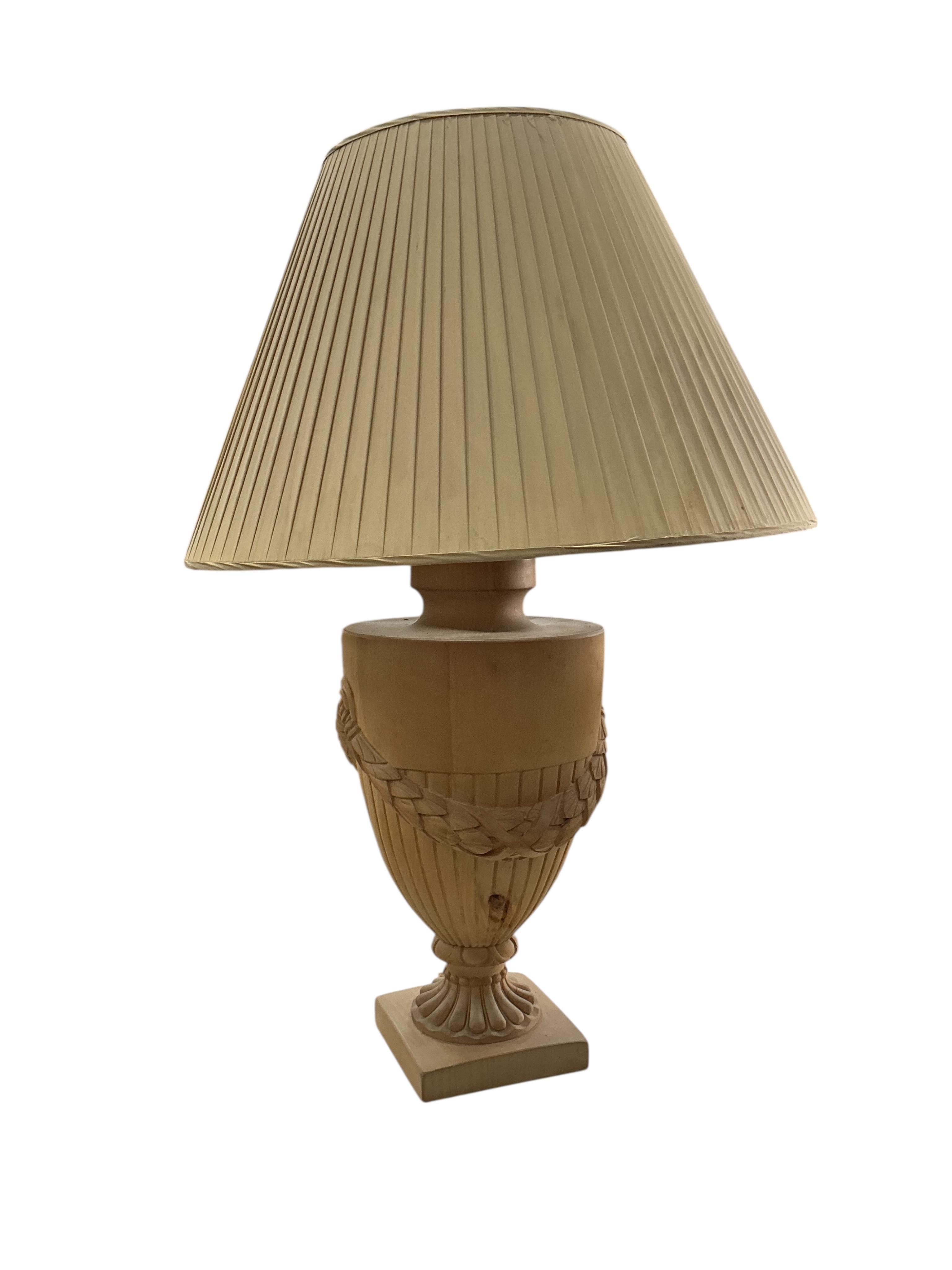 A pair of beech campana urn shaped lamps with shades, height including shades 90cm, Provenance: The late Kenneth Turner (1936-2025), celebrity florist, designer and perfume retailer, he received the Royal Warrant from th